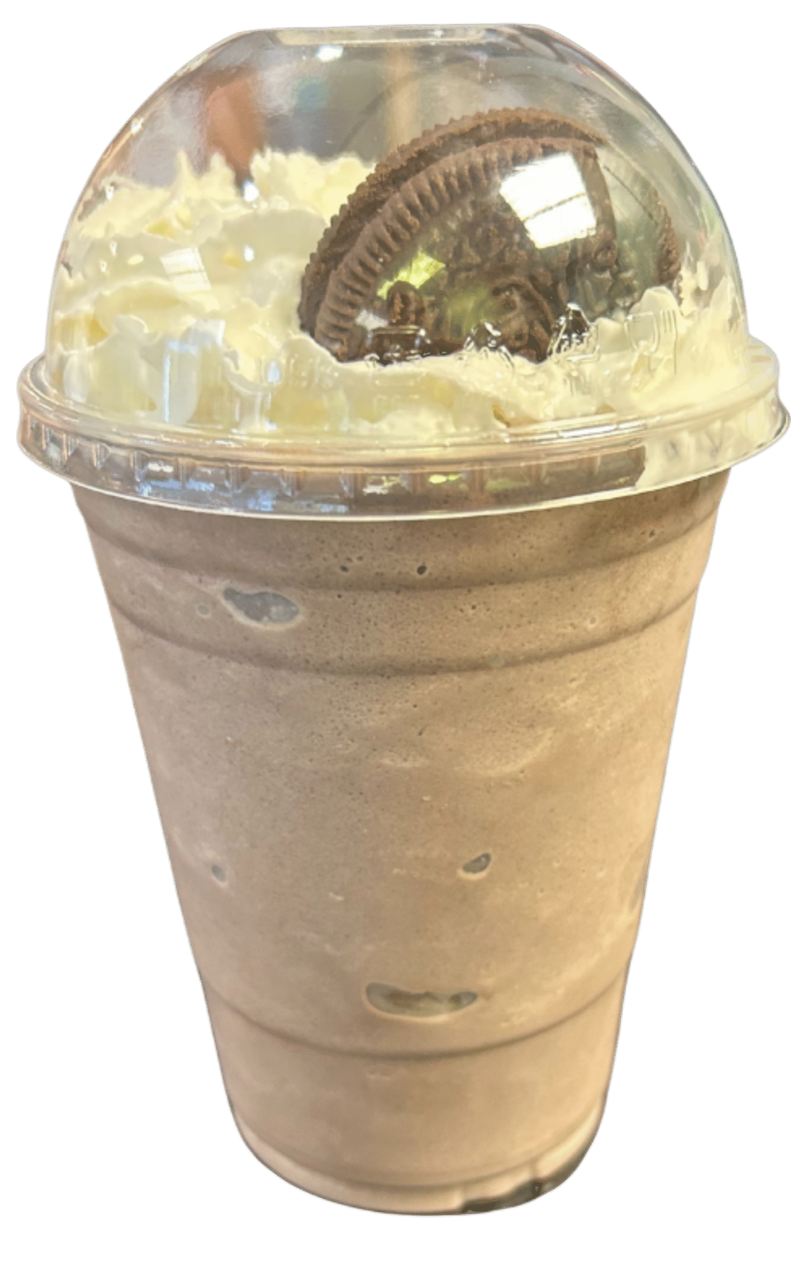 A creamy orange beverage topped with whipped cream and a drizzle of orange sauce, labeled "Dreamsicle" in red.